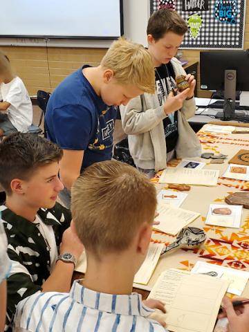 students analyzing artifacts 