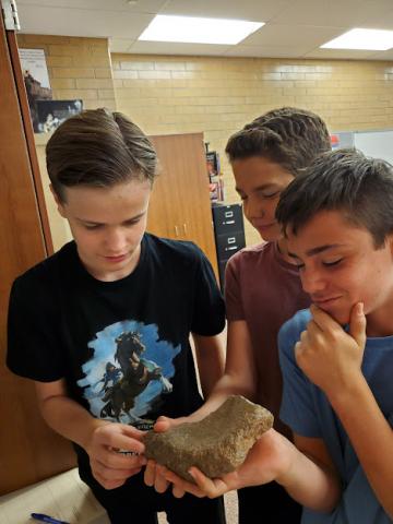 students analyzing artifacts 
