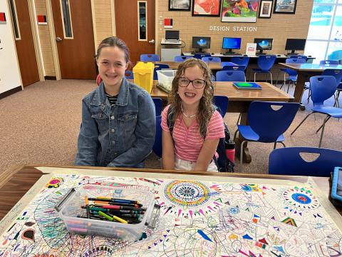 students coloring in the library